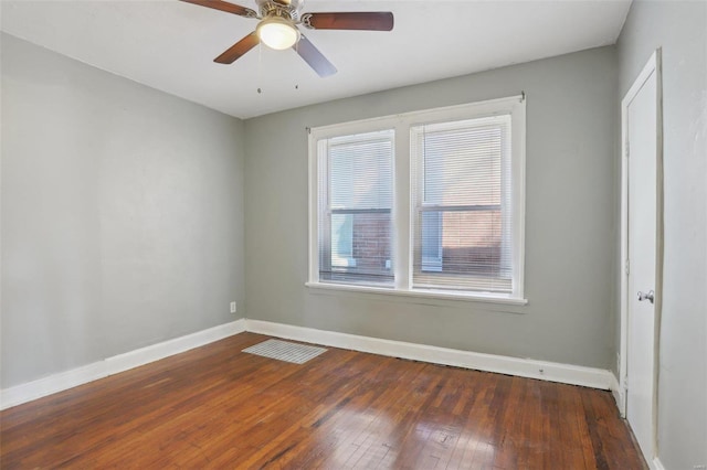 4644 Minnesota Ave, Saint Louis, MO 63111 - spare room with baseboards, dark wood finished floors, and ceiling fan