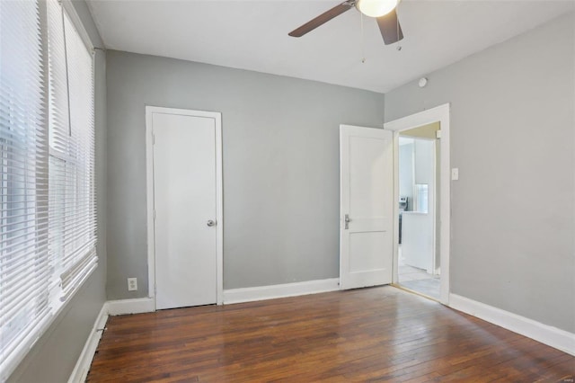 4644 Minnesota Ave, Saint Louis, MO 63111 - unfurnished bedroom featuring wood-type flooring, baseboards, and a ceiling fan