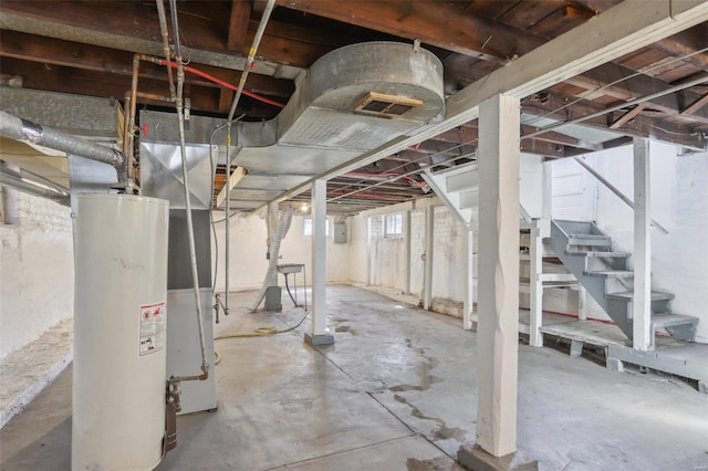 4644 Minnesota Ave, Saint Louis, MO 63111 - basement featuring stairway, gas water heater, and electric panel