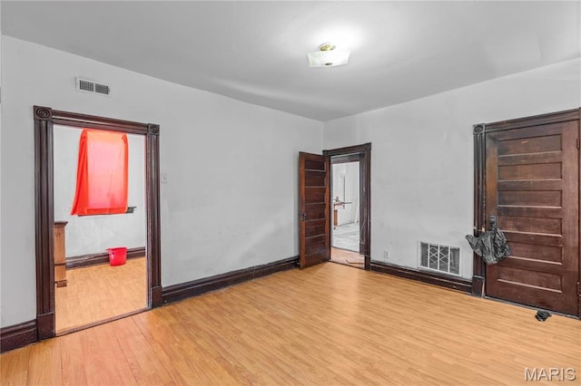 3737 Cottage Ave, Saint Louis, MO 63113 - empty room featuring wood finished floors and baseboards