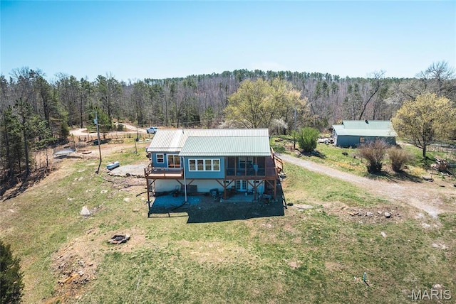 5819 Highway Vv Hwy, Vv, MO 65542 - back of property with a forest view, a yard, and metal roof