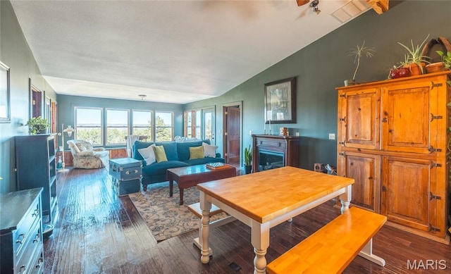 5819 Highway Vv Hwy, Vv, MO 65542 - dining area with lofted ceiling and dark wood-type flooring