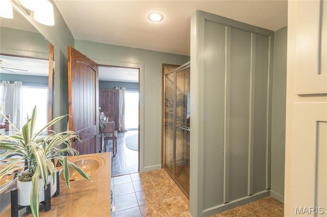 5819 Highway Vv Hwy, Vv, MO 65542 - full bathroom featuring a stall shower, tile patterned flooring, a ceiling fan, a sink, and baseboards