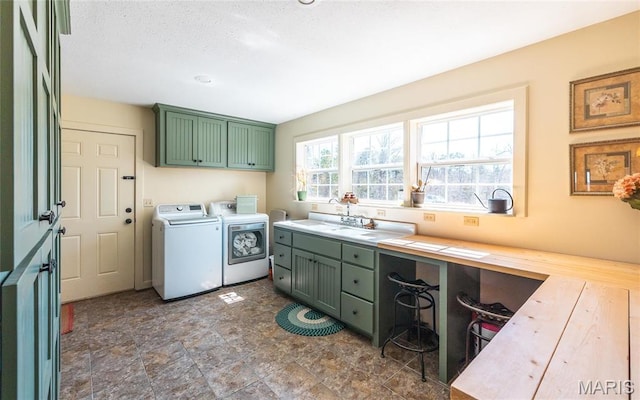 5819 Highway Vv Hwy, Vv, MO 65542 - clothes washing area featuring independent washer and dryer, cabinet space, stone finish floors, and an office area