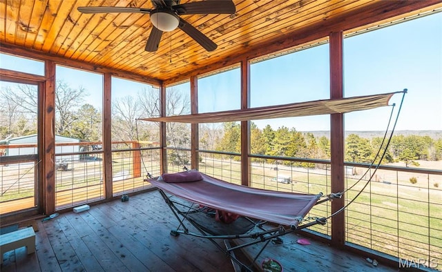 5819 Highway Vv Hwy, Vv, MO 65542 - sunroom with wood ceiling, a deck, ceiling fan, hardwood / wood-style flooring, and plenty of natural light