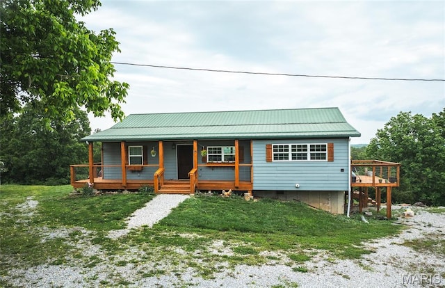5819 Highway Vv Hwy, Vv, MO 65542 - view of front of home featuring covered porch, metal roof, and a front yard