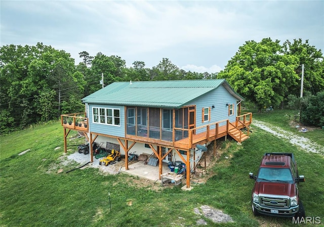 5819 Highway Vv Hwy, Vv, MO 65542 - back of property with a sunroom, a deck, a yard, and metal roof
