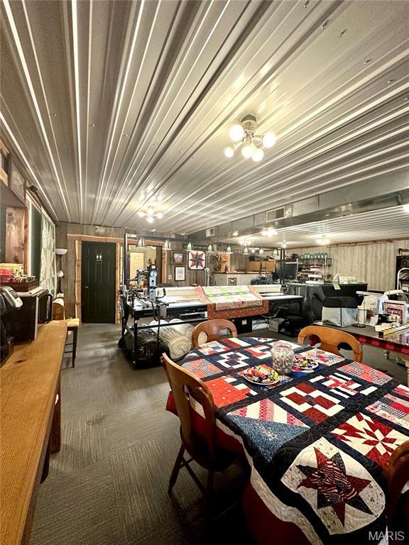 504 Alvarado Ave, Belle, MO 65013 - miscellaneous room featuring carpet floors and wooden walls