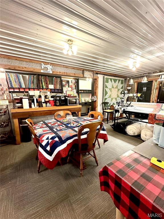 504 Alvarado Ave, Belle, MO 65013 - carpeted dining area featuring wooden ceiling