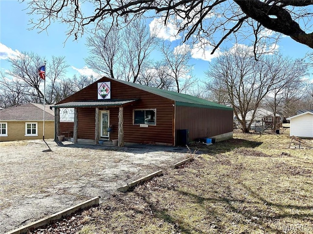 504 Alvarado Ave, Belle, MO 65013 - back of property featuring faux log siding and a porch
