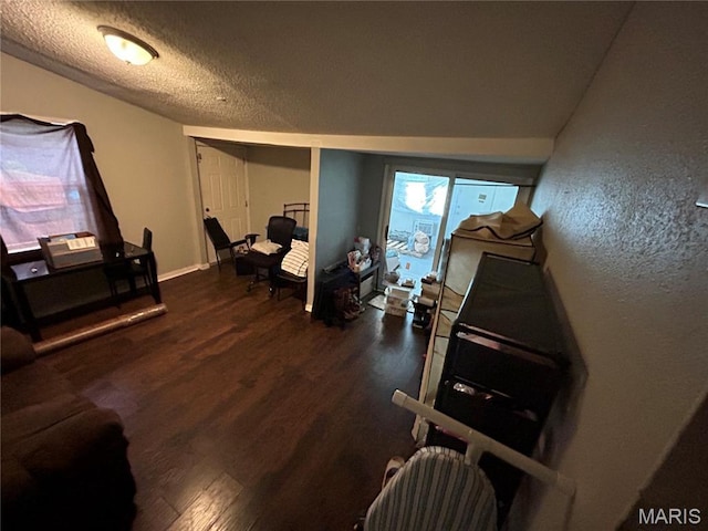 114 Bernhardt Ave, Saint Louis, MO 63121 - living room with dark wood-style floors and a textured ceiling