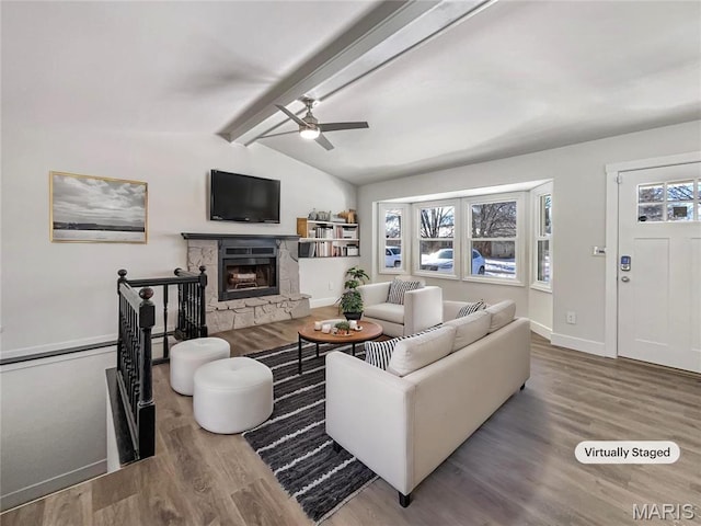 38 N Lang Dr, Ofallon, MO 63366 - living area featuring ceiling fan, wood finished floors, and a stone fireplace