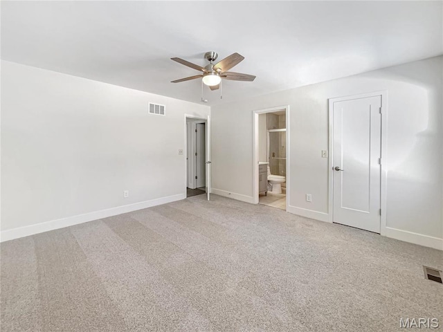 38 N Lang Dr, Ofallon, MO 63366 - unfurnished bedroom featuring light colored carpet, ensuite bathroom, and ceiling fan