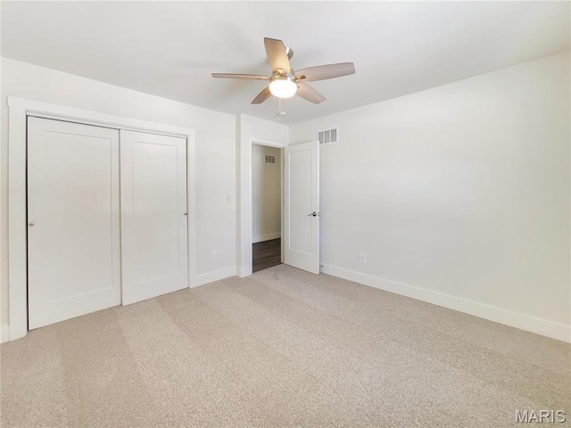 38 N Lang Dr, Ofallon, MO 63366 - unfurnished bedroom with light colored carpet, a closet, and a ceiling fan