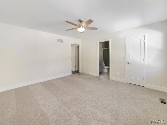38 N Lang Dr, Ofallon, MO 63366 - unfurnished bedroom with light carpet, connected bathroom, and a ceiling fan