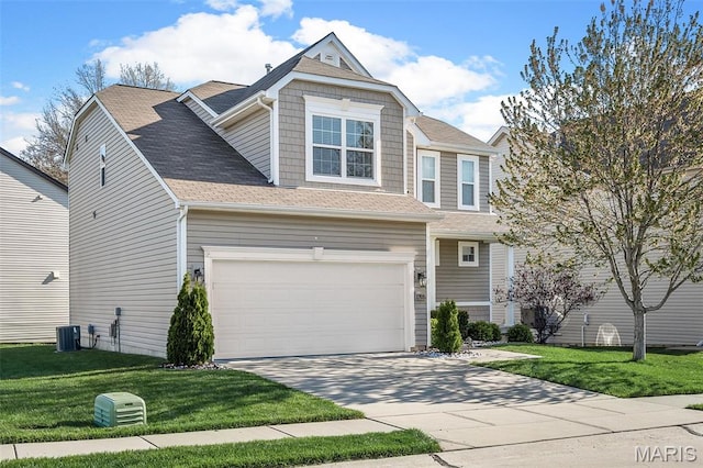 1705 Belleau Wood Dr, Saint Peters, MO 63376 - view of front of home featuring concrete driveway, a front yard, central AC unit, and a shingled roof