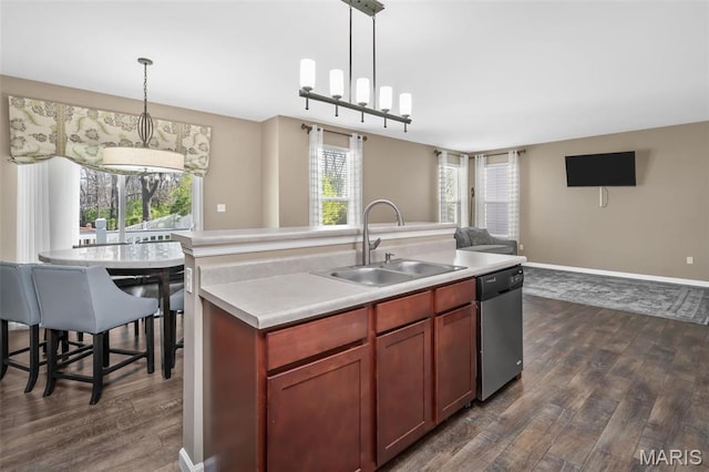 1705 Belleau Wood Dr, Saint Peters, MO 63376 - kitchen with dishwasher, a sink, open floor plan, dark wood-style floors, and a center island with sink