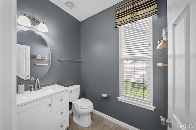 1705 Belleau Wood Dr, Saint Peters, MO 63376 - half bath featuring toilet, healthy amount of natural light, tile patterned floors, and vanity