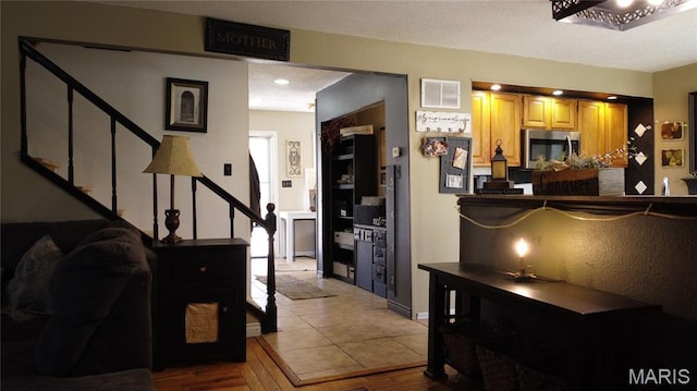 338 Mont Pellier St, Bonne Terre, MO 63628 - kitchen featuring stainless steel microwave and wood finished floors