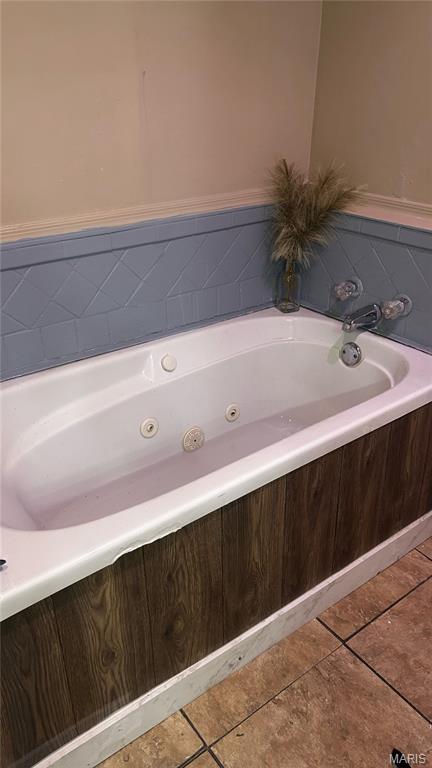 338 Mont Pellier St, Bonne Terre, MO 63628 - full bath with a tub with jets and tile patterned floors