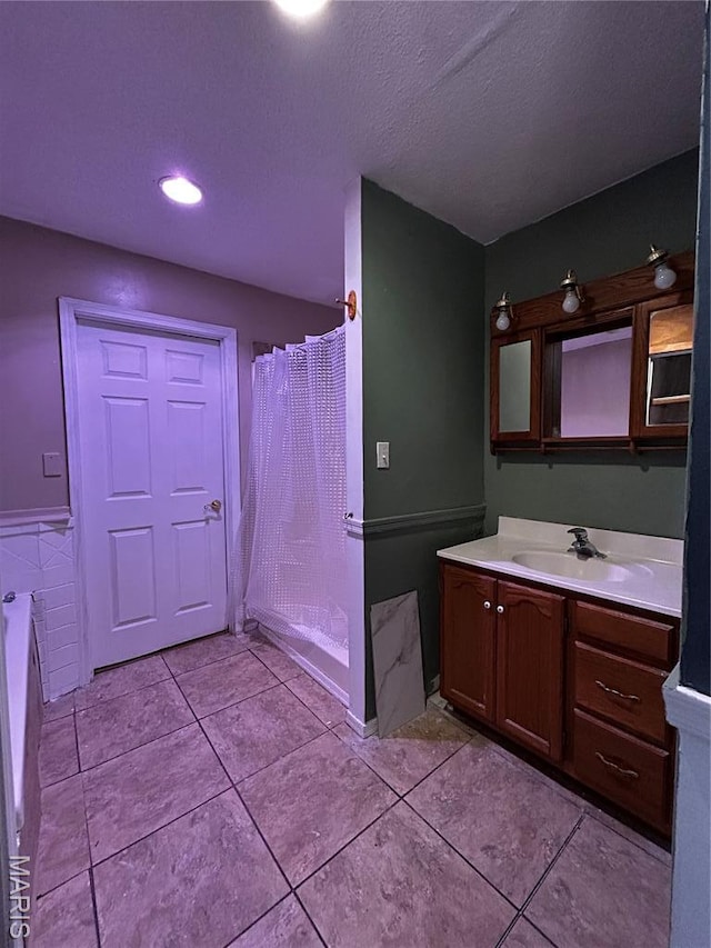 338 Mont Pellier St, Bonne Terre, MO 63628 - bathroom featuring vanity, a bath, tile patterned floors, a shower with shower curtain, and a textured ceiling