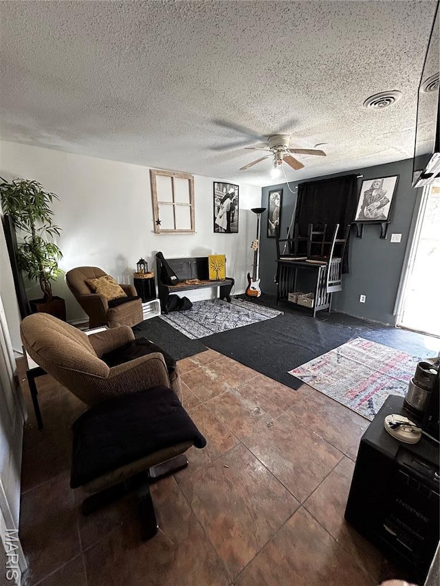 338 Mont Pellier St, Bonne Terre, MO 63628 - living area with ceiling fan and a textured ceiling
