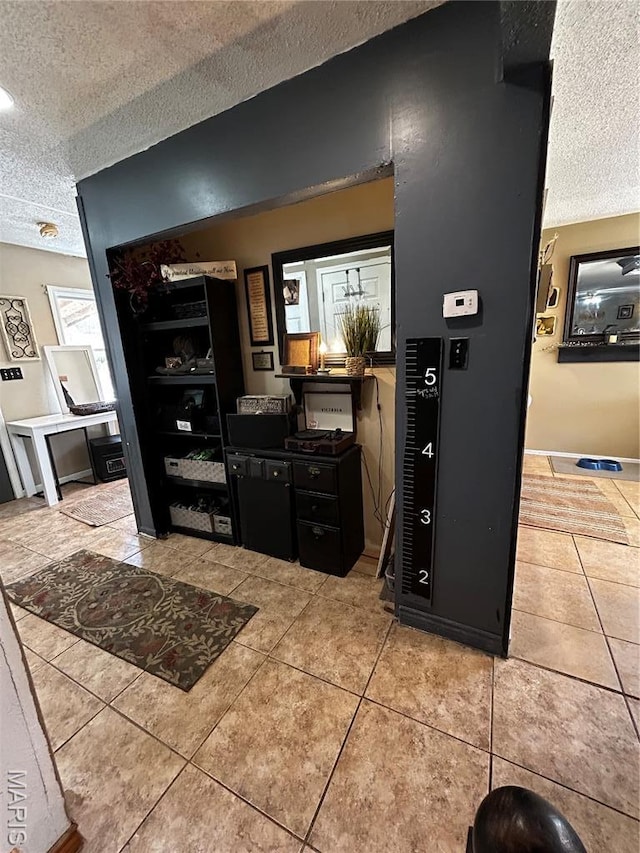 338 Mont Pellier St, Bonne Terre, MO 63628 - living area featuring a textured ceiling and light tile patterned floors