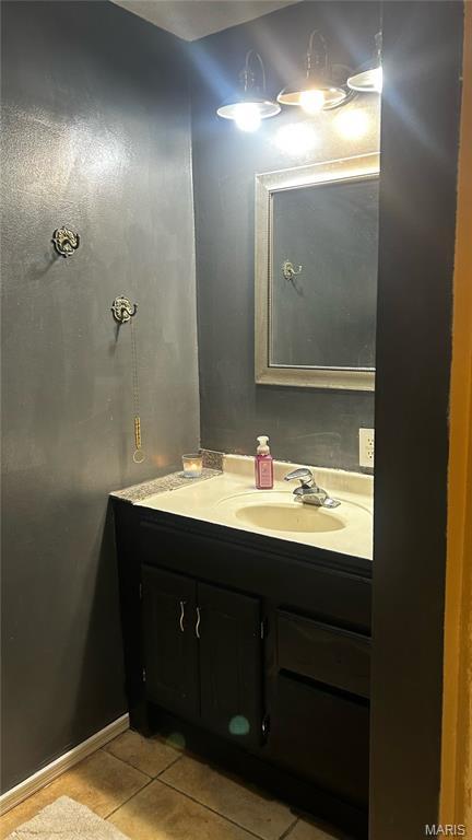 338 Mont Pellier St, Bonne Terre, MO 63628 - bathroom featuring tile patterned floors and vanity
