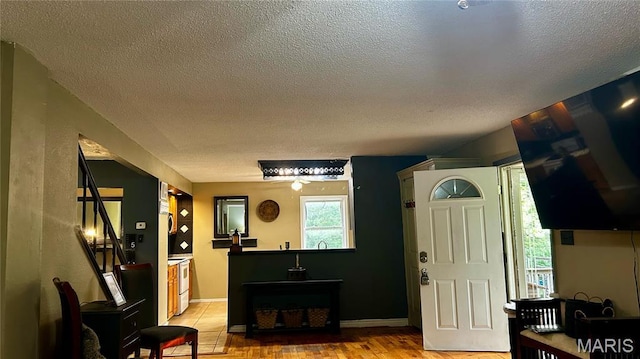 338 Mont Pellier St, Bonne Terre, MO 63628 - living area with a textured ceiling and light wood-type flooring