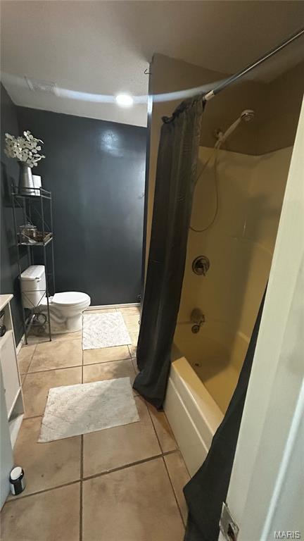 338 Mont Pellier St, Bonne Terre, MO 63628 - full bath with tile patterned floors, shower / bathtub combination with curtain, toilet, and vanity