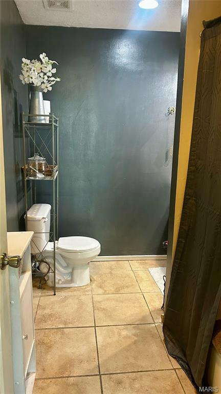 338 Mont Pellier St, Bonne Terre, MO 63628 - bathroom with toilet and tile patterned floors