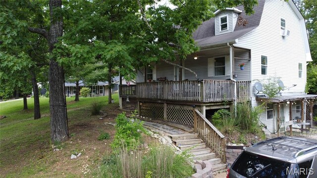 338 Mont Pellier St, Bonne Terre, MO 63628 - view of front of house with a porch, a gambrel roof, and a shingled roof