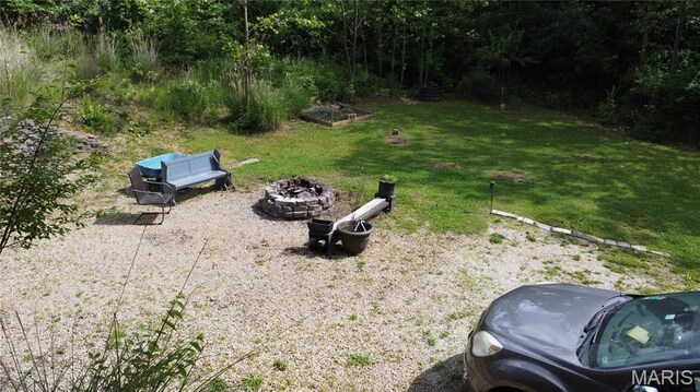 338 Mont Pellier St, Bonne Terre, MO 63628 - view of green lawn featuring a fire pit