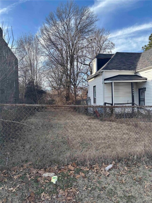 2803 Semple Ave, Saint Louis, MO 63120 - view of property exterior with fence and a shingled roof