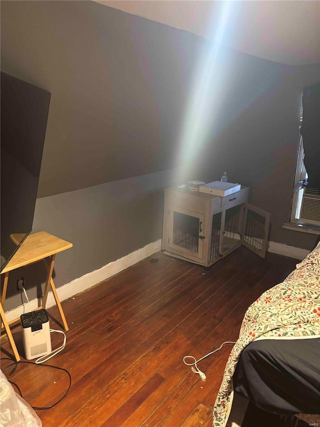 2803 Semple Ave, Saint Louis, MO 63120 - bedroom with wood-type flooring, baseboards, and lofted ceiling