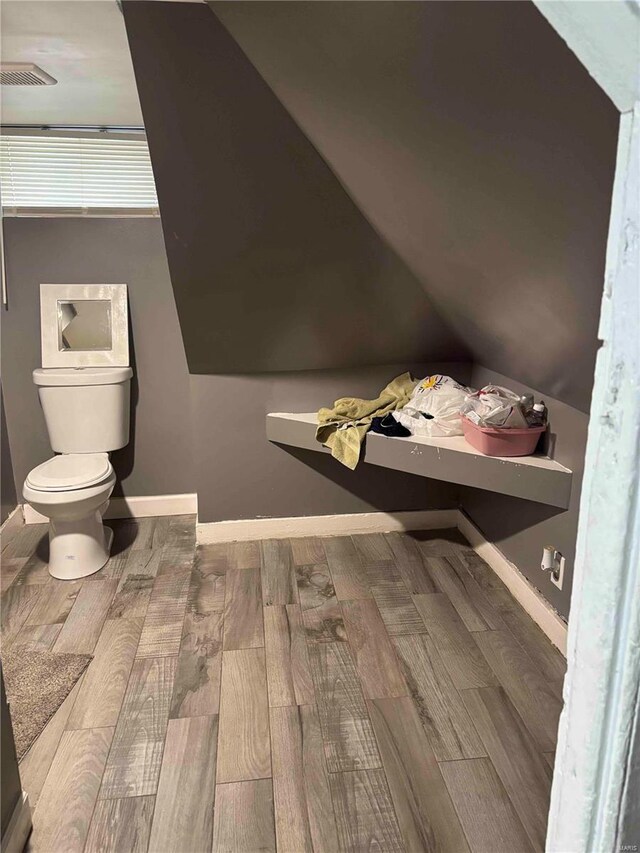 2803 Semple Ave, Saint Louis, MO 63120 - additional living space with wood finished floors, baseboards, and lofted ceiling