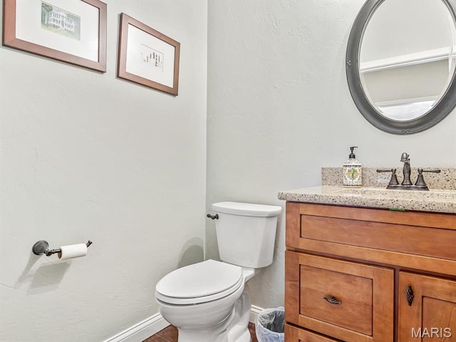103 Evergreen Ct, Waterloo, IL 62298 - bathroom featuring baseboards, vanity, and toilet