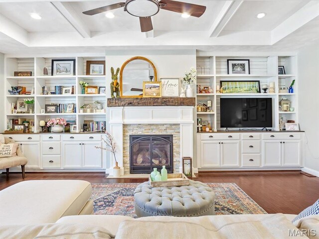103 Evergreen Ct, Waterloo, IL 62298 - living room featuring beam ceiling, dark wood-style floors, a ceiling fan, and a stone fireplace