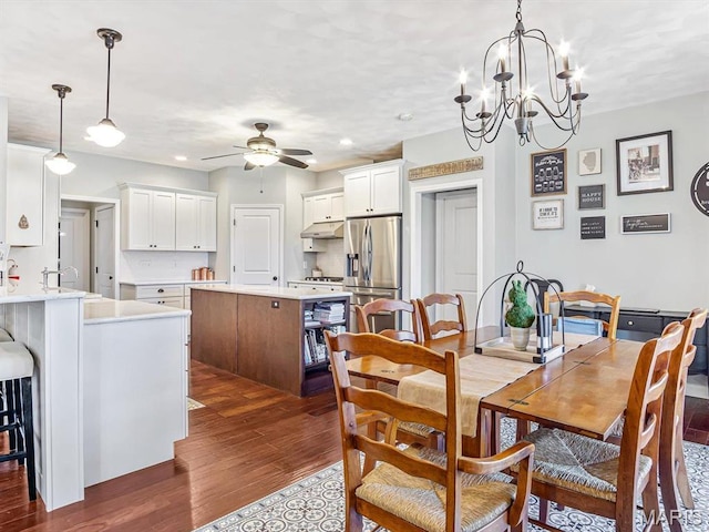 103 Evergreen Ct, Waterloo, IL 62298 - dining room featuring dark wood-style flooring, ceiling fan, and a chandelier