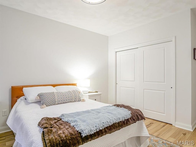 103 Evergreen Ct, Waterloo, IL 62298 - bedroom with light wood-style flooring, a closet, and baseboards