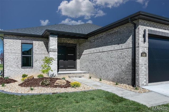 1519 Oglesby Dr, Edwardsville, IL 62025 - entrance to property with brick siding, a garage, and a shingled roof