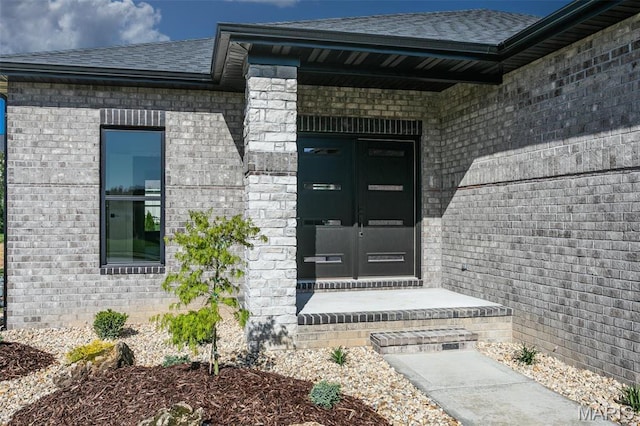 1519 Oglesby Dr, Edwardsville, IL 62025 - entrance to property featuring a shingled roof, brick siding, and french doors