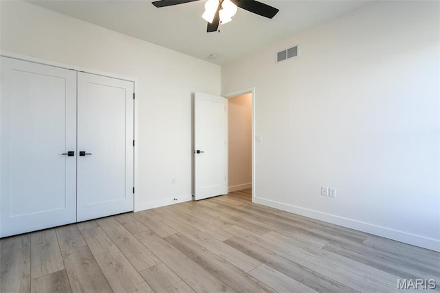 1519 Oglesby Dr, Edwardsville, IL 62025 - unfurnished bedroom with light wood finished floors, a closet, and a ceiling fan