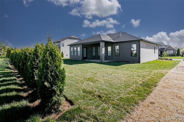 1519 Oglesby Dr, Edwardsville, IL 62025 - rear view of property with a yard and a patio