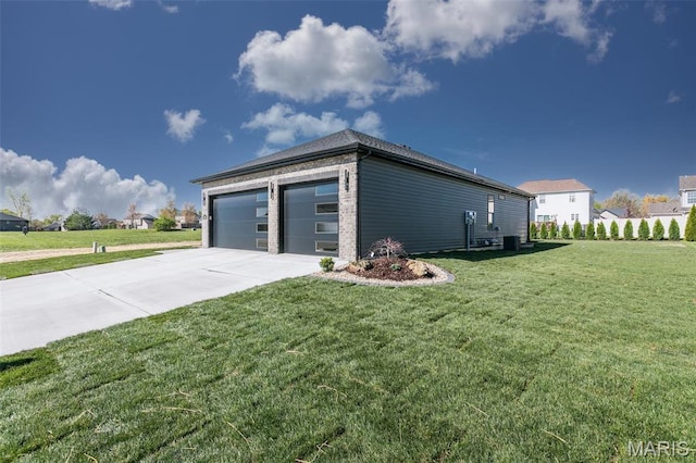 1519 Oglesby Dr, Edwardsville, IL 62025 - view of property exterior with concrete driveway, a yard, and a garage