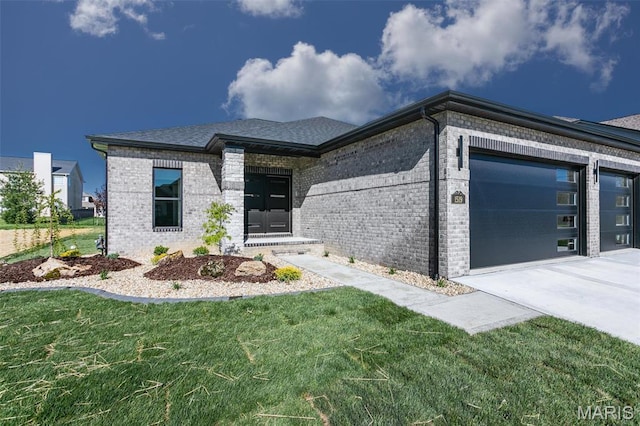 1519 Oglesby Dr, Edwardsville, IL 62025 - view of front of house with brick siding, a garage, and a front yard