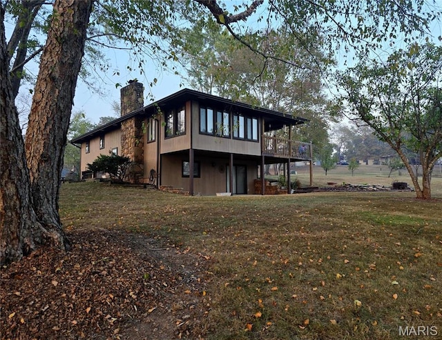 266 Hunt Club Cir, Galena, MO 65656 - rear view of house with a chimney, a lawn, and a deck