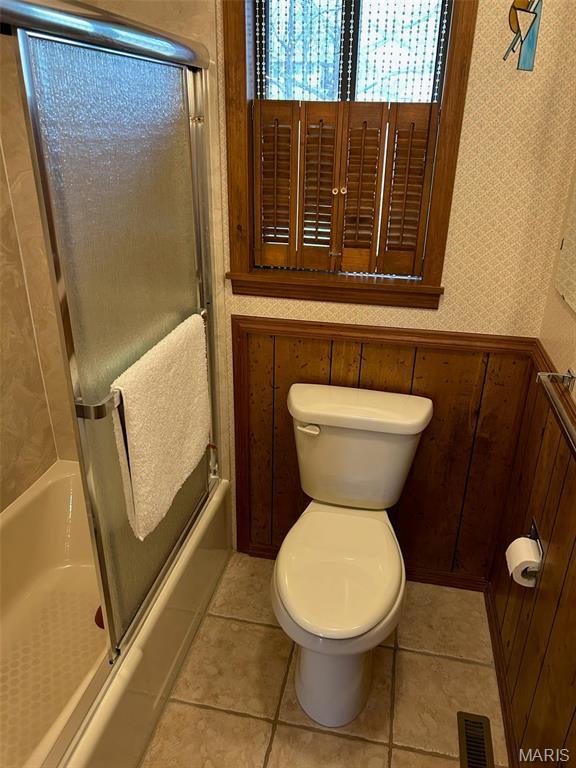 266 Hunt Club Cir, Galena, MO 65656 - full bath featuring enclosed tub / shower combo, toilet, and tile patterned flooring