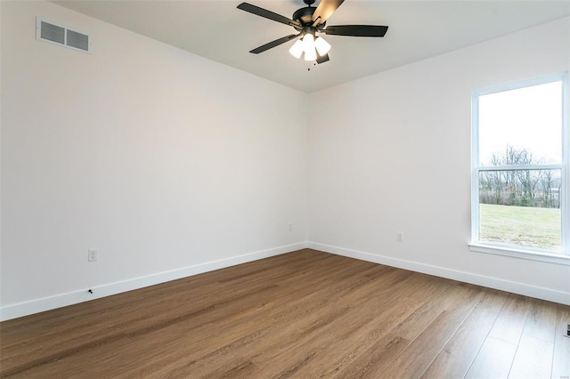 1511 Oglesby Dr, Edwardsville, IL 62025 - empty room featuring dark wood-type flooring, baseboards, and a ceiling fan