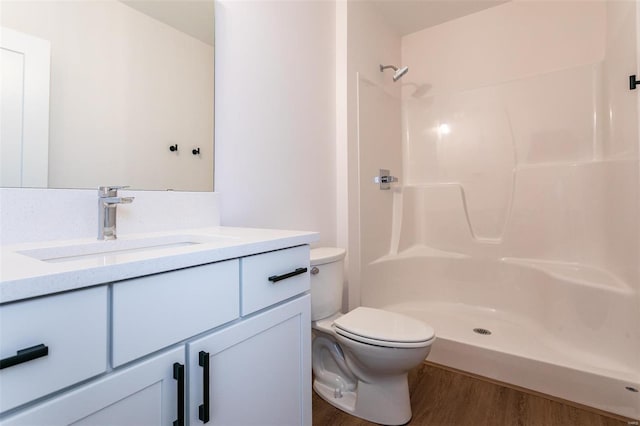 1511 Oglesby Dr, Edwardsville, IL 62025 - bathroom with toilet, wood finished floors, a shower, and vanity